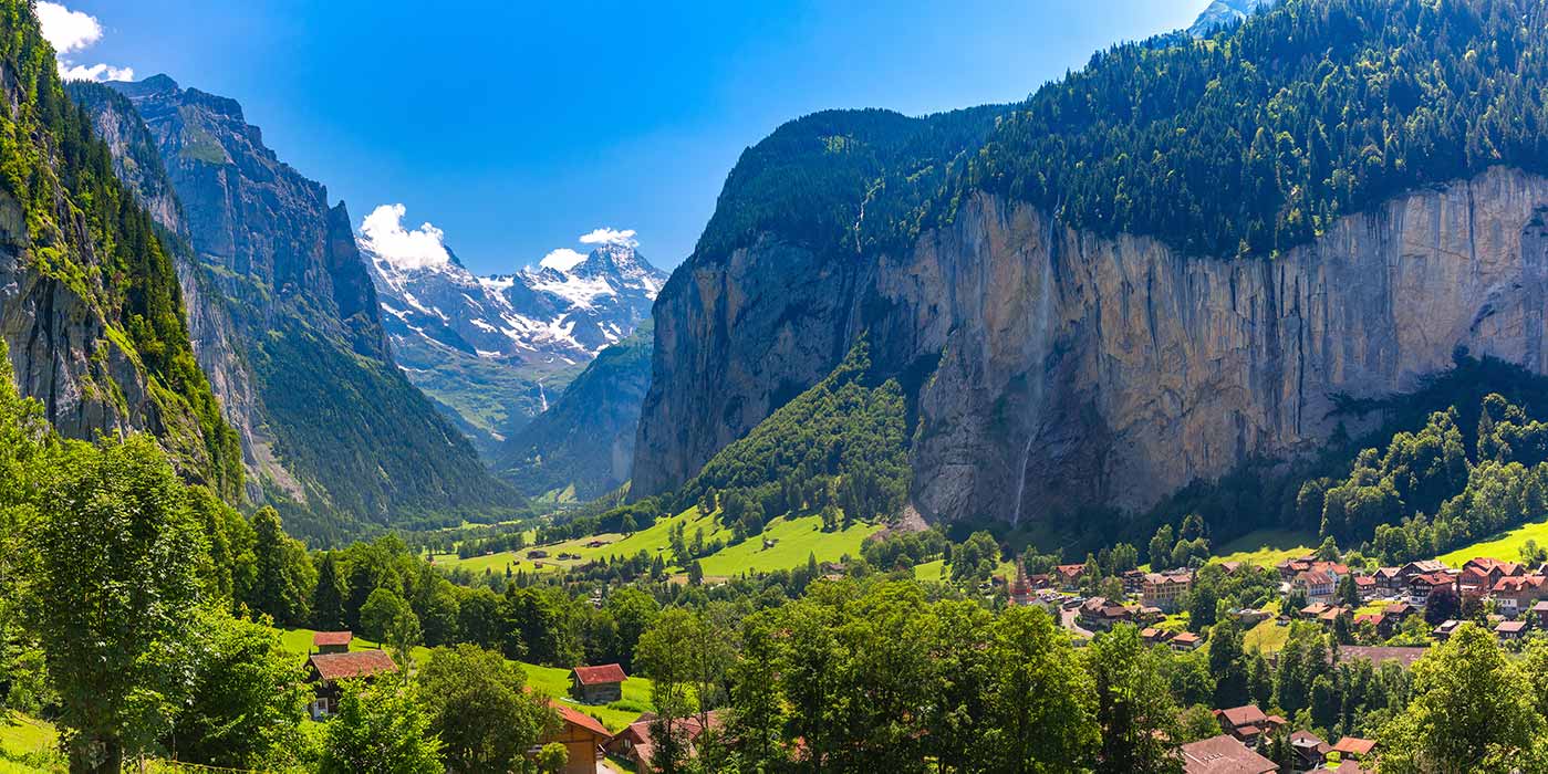 Lauterbrunnen Valley, Switzerland. snow capped mountain in background of green valley.